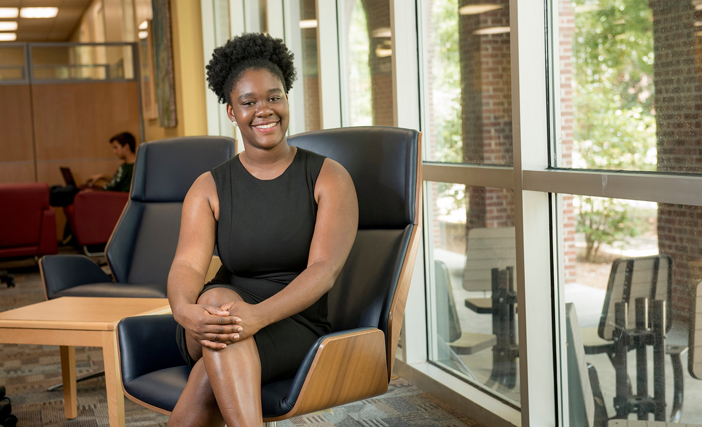 student sitting in a chair