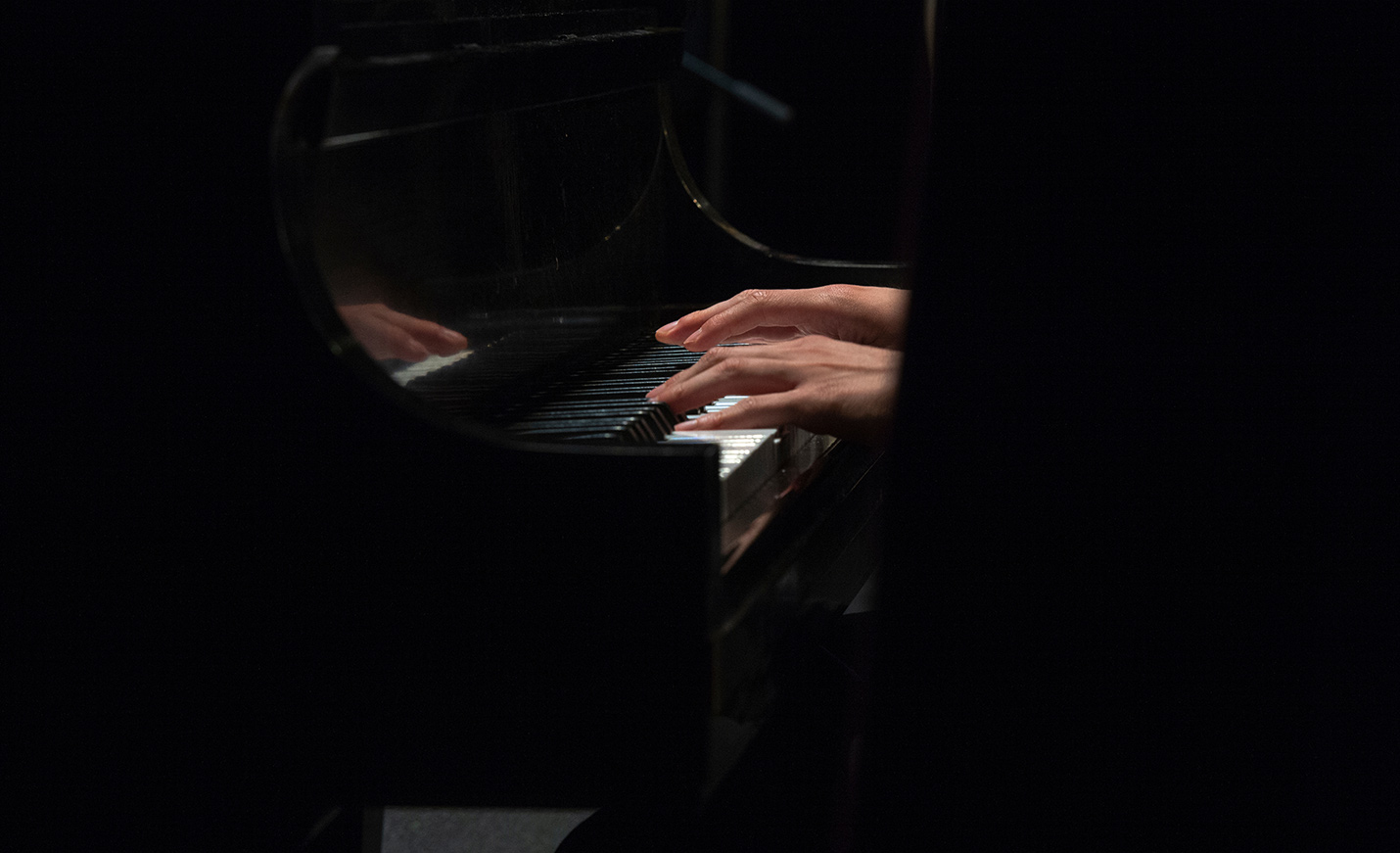 Hands playing piano