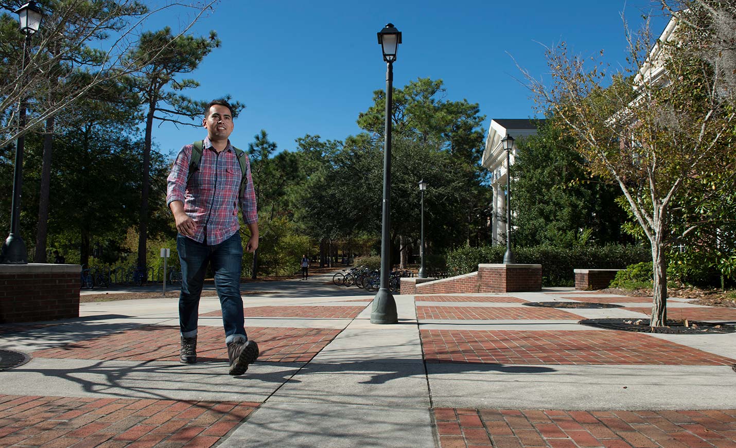 A student walking on Chancellor's Walk