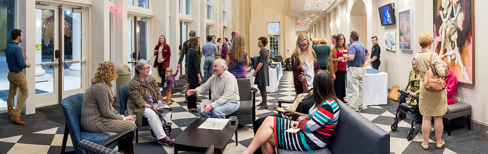 Patrons in the lobby of the CAB Building