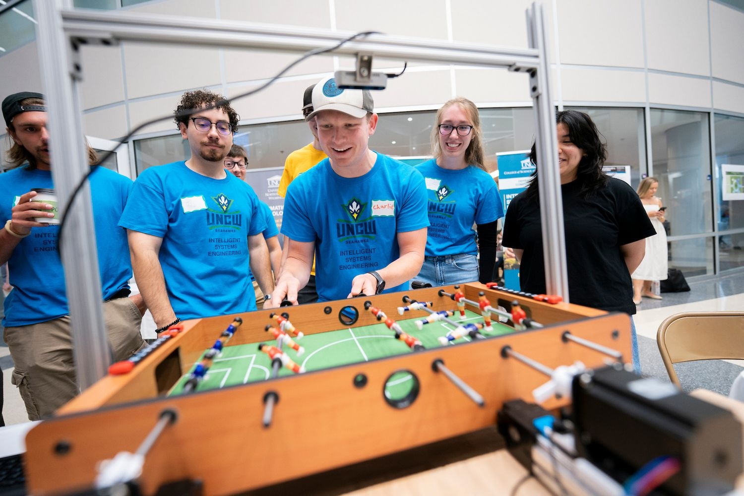 Students playing foosball during computing showcase
